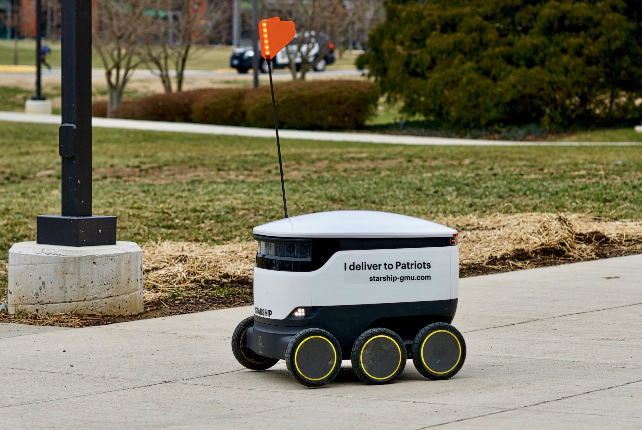 Robotic delivery device on a sidewalk